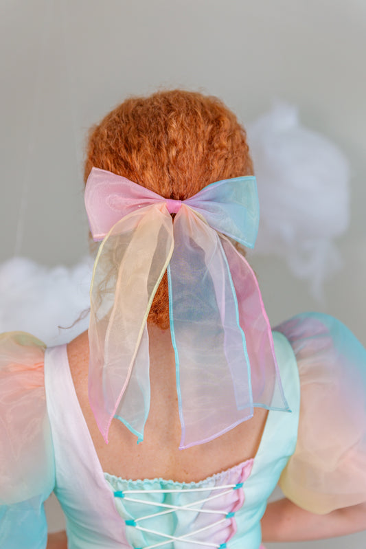 Back view of the pastel Daybreak bow with cloud props