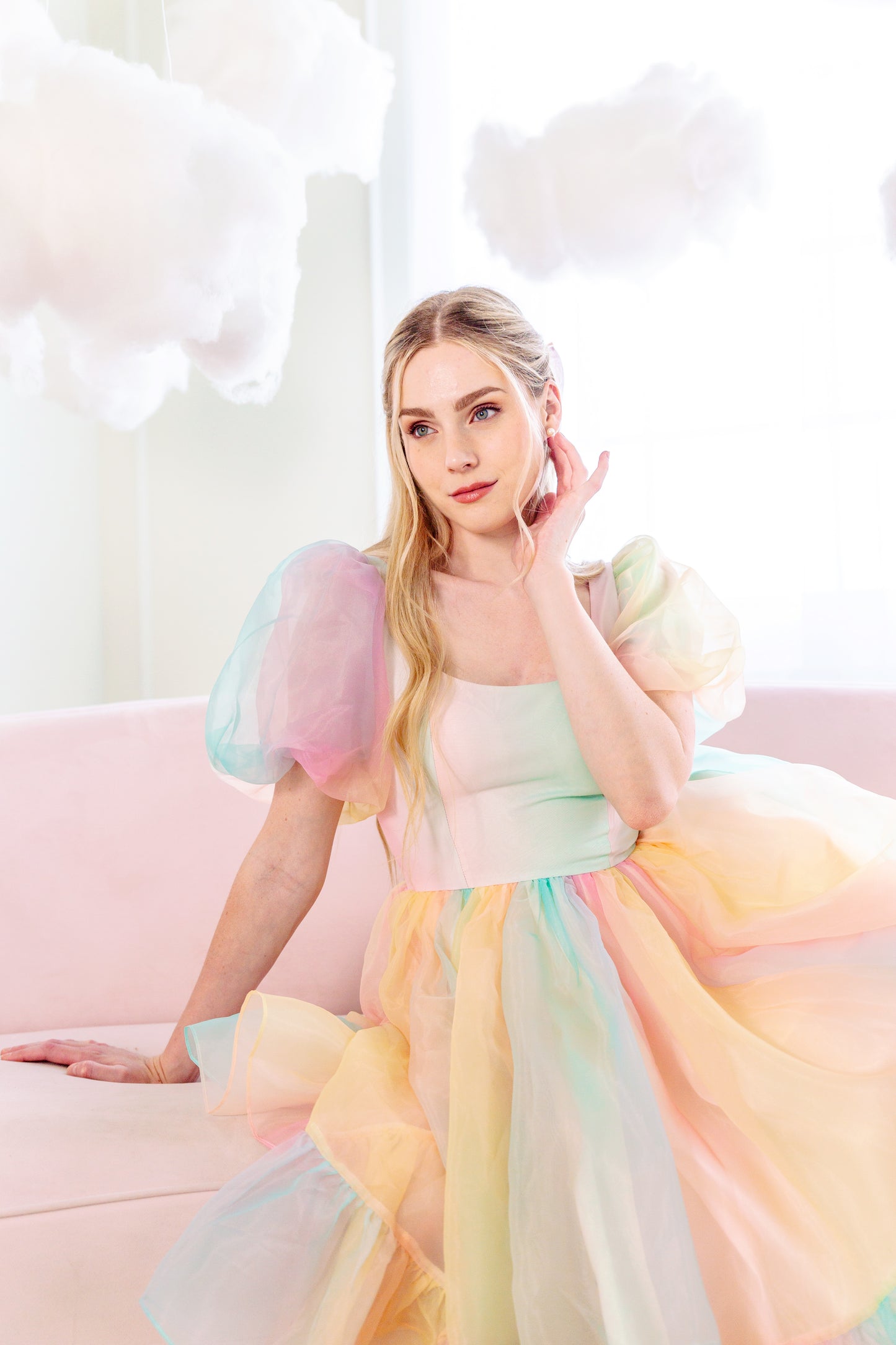 Novella Dress Deluxe twirl in front of cloud backdrop, full view