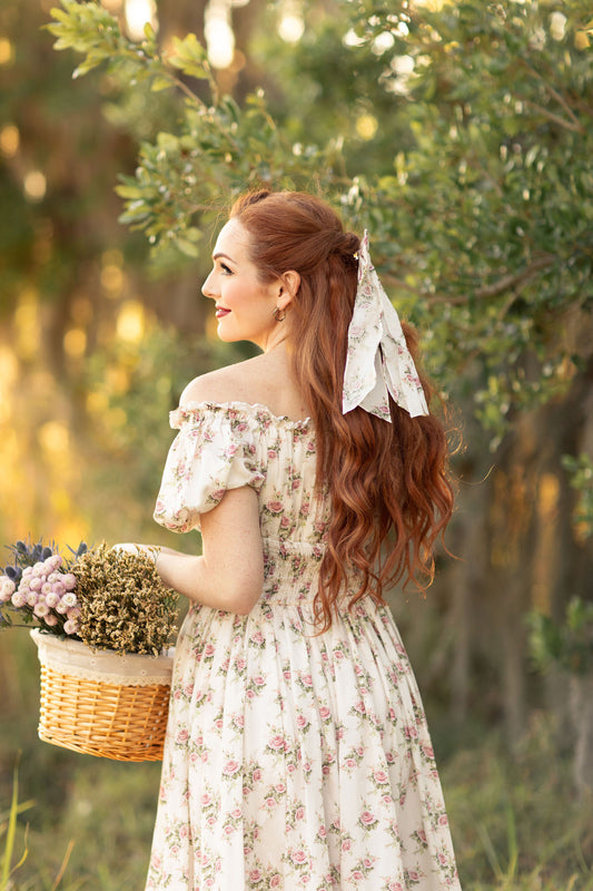 Back view of floral dress and bow, strolling with basket