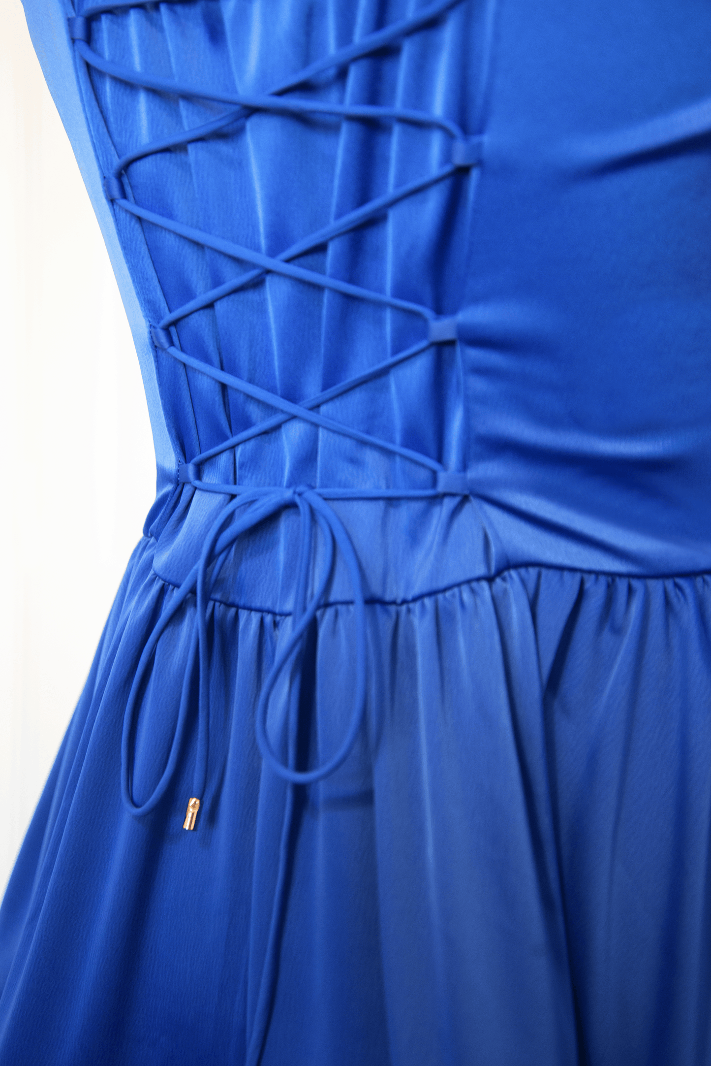Close-up of the lace-up corset back on the Sapphire Blue Madonna Dress