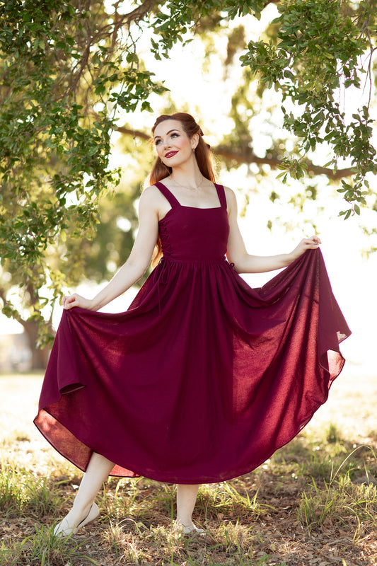 Romantic outdoor pose wearing The Rosemary Dress in the Cottagecore Collection